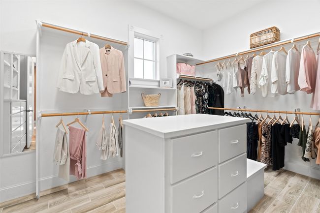 Spacious closet featuring wood tiled floor | Image 15