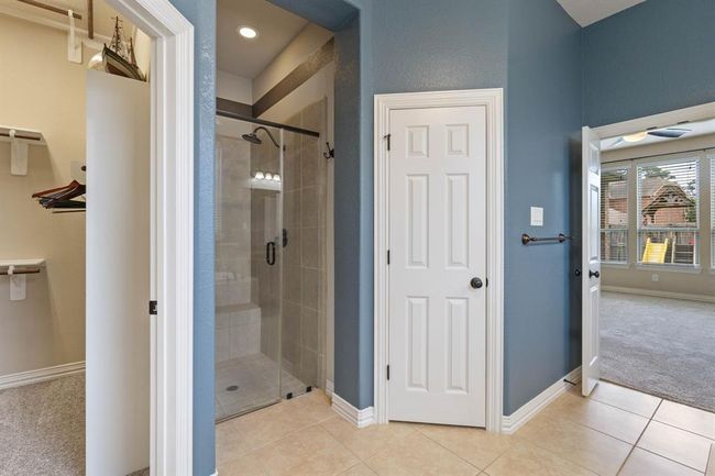 Roomy walk-in shower and private restroom area. | Image 24