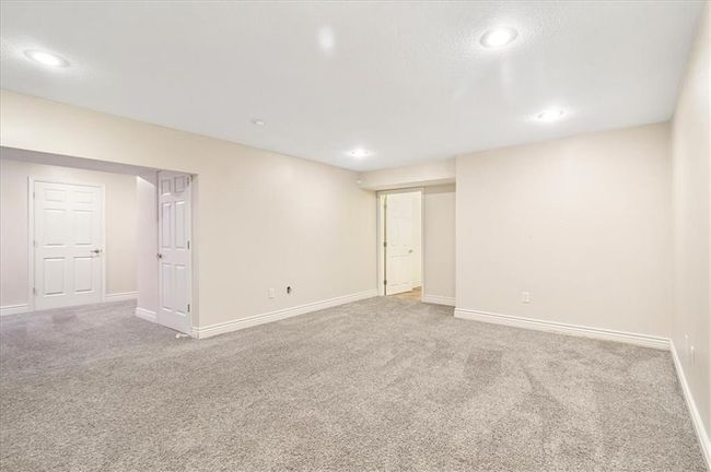 Finished basement featuring baseboards, carpet, and recessed lighting | Image 36
