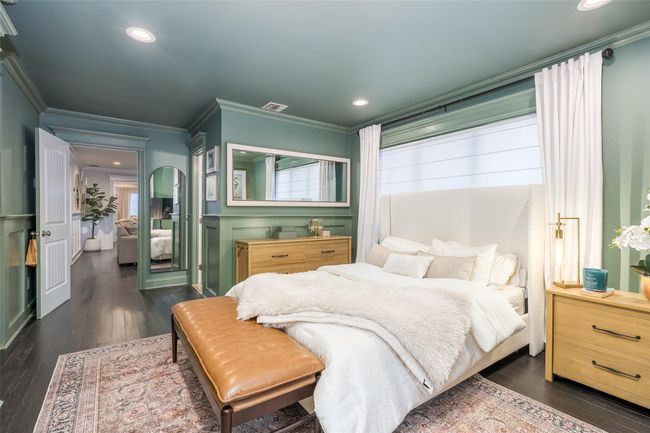 Bedroom with visible vents, dark wood-style flooring, recessed lighting, and crown molding | Image 25