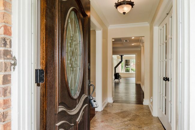 Foyer featuring crown molding and baseboards | Image 5
