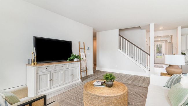 Living room featuring stairway, light wood-type flooring, and baseboards | Image 6