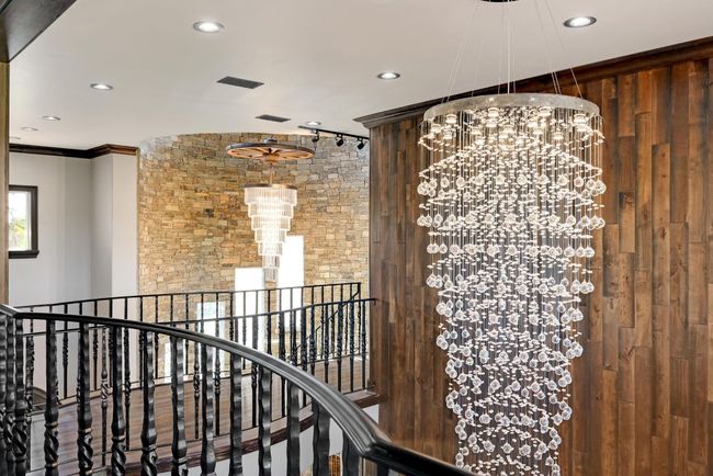 Corridor with ornamental molding, an upstairs landing, an inviting chandelier, and recessed lighting | Image 9