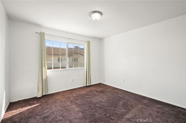 Upstairs: Bedroom 1 with wall-to-wall closet | Image 10