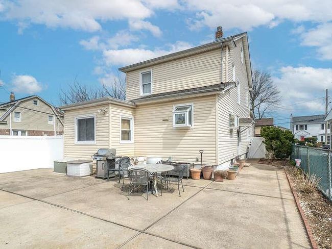 Back of house with a patio and a fenced backyard | Image 11