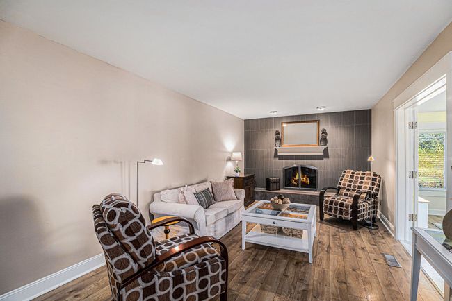 Beautiful family room with chic tiled accent wall. | Image 8