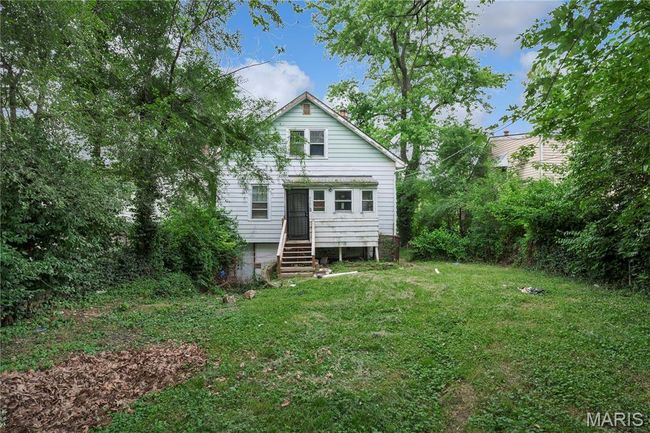 Rear view of house with a lawn | Image 4