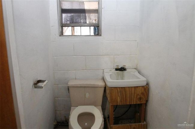 Bathroom with sink and toilet | Image 6