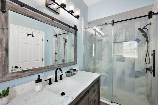 Primary ensuite bathroom with new tiled walk-in shower and new vanity | Image 15