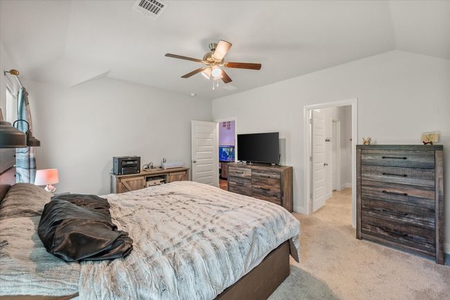 Bedroom with light carpet, lofted ceiling, and ceiling fan | Image 20