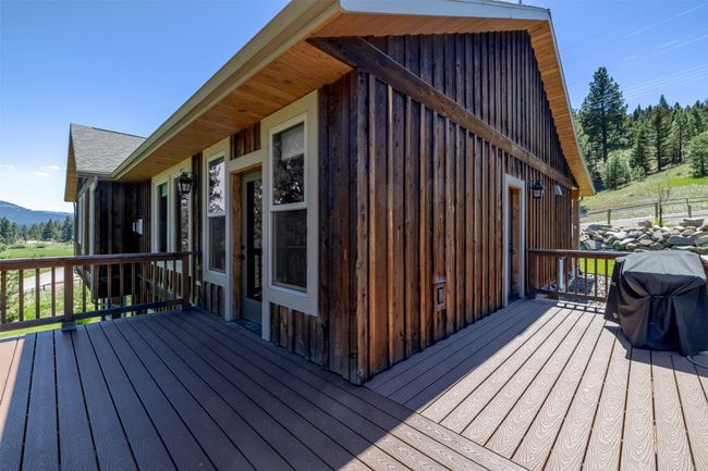 Deck with a grill and a mountain view | Image 44