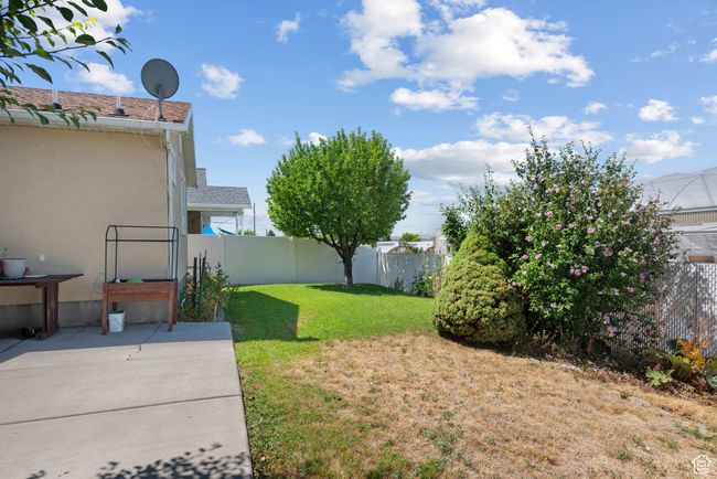 Fenced backyard featuring a patio | Image 30