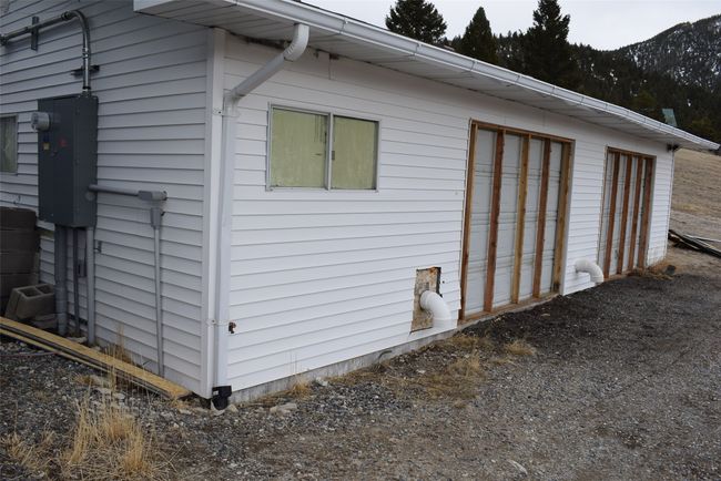 View of property exterior with a garage | Image 91