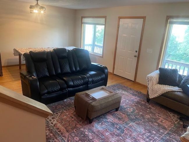 Enter to the spacious Living/Dining. Room Note the Wood Floors & Ceiling Fan. | Image 5