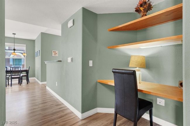 Home office featuring wood like finished floors and baseboards | Image 7