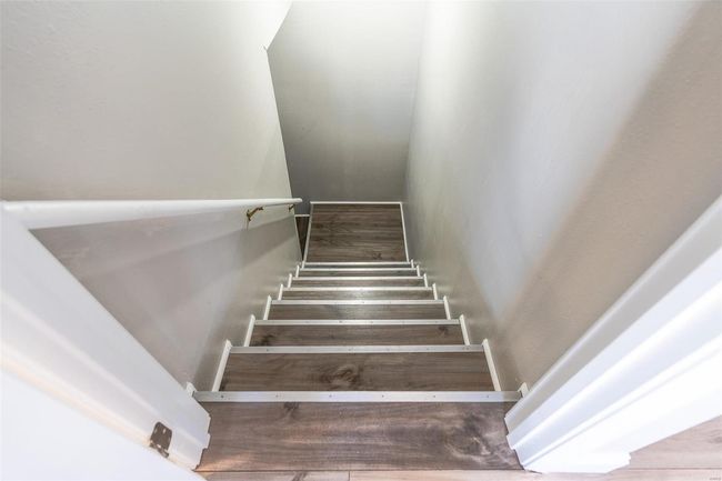 Staircase featuring / wood-style floors | Image 46