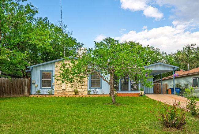 View of front facade with concrete driveway and board and batten siding | Image 28