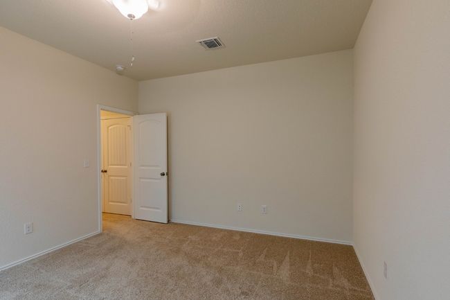 Carpeted spare room featuring baseboards | Image 18