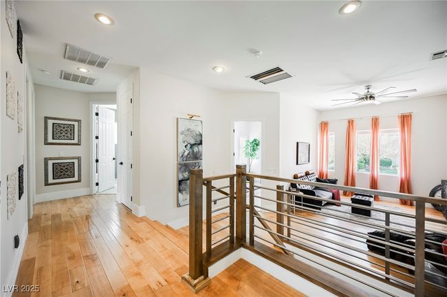 Hallway with visible vents, an upstairs landing, recessed lighting, and light wood finished floors | Image 38