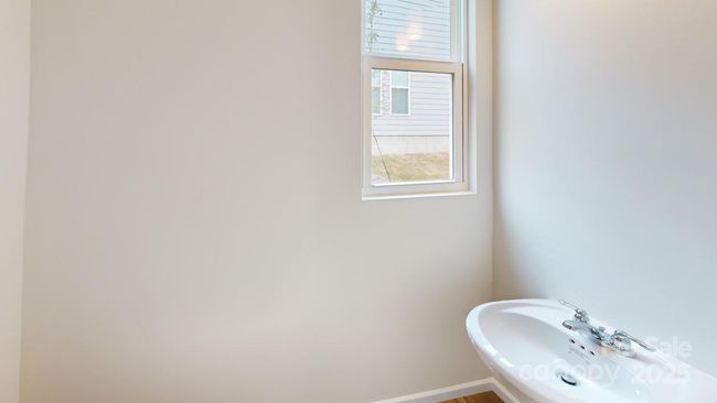 Photo is representation - Half bath located on main level | Image 11