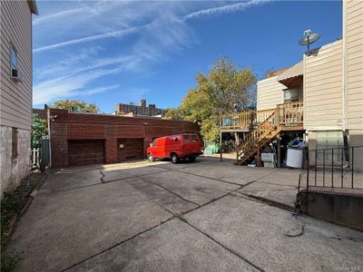 View of car parking with a garage | Image 2