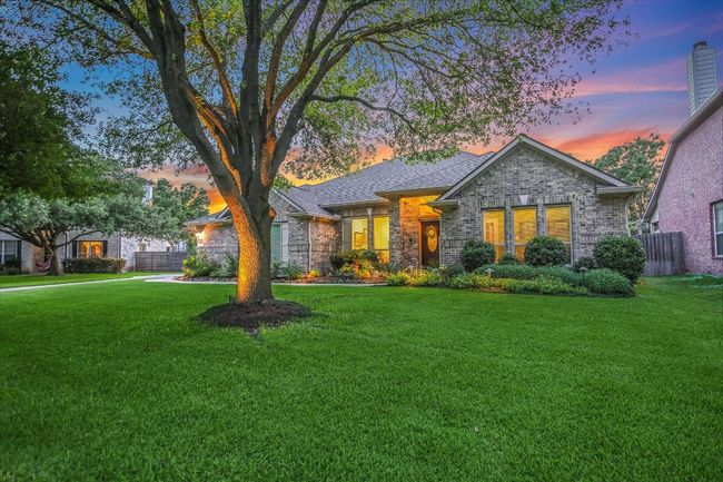 View of front of property featuring brick siding and a shingled roof | Image 6