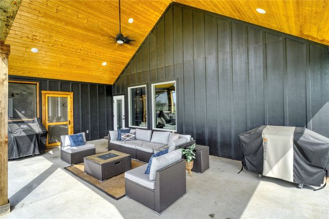 View of patio / terrace featuring area for grilling and an outdoor hangout area | Image 35