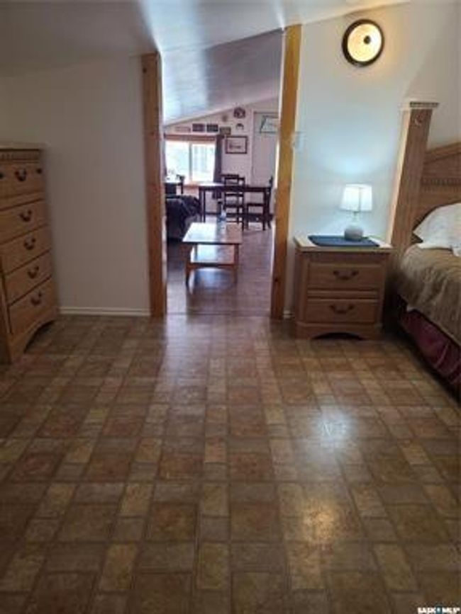 Bedroom featuring lofted ceiling | Image 29