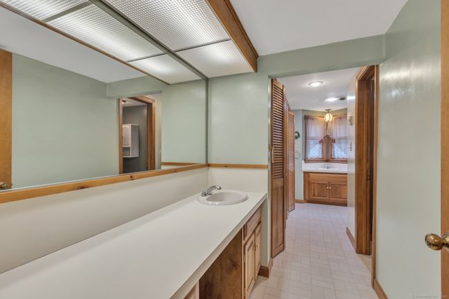 Expansive Main Full Bath with laundry and closet | Image 27