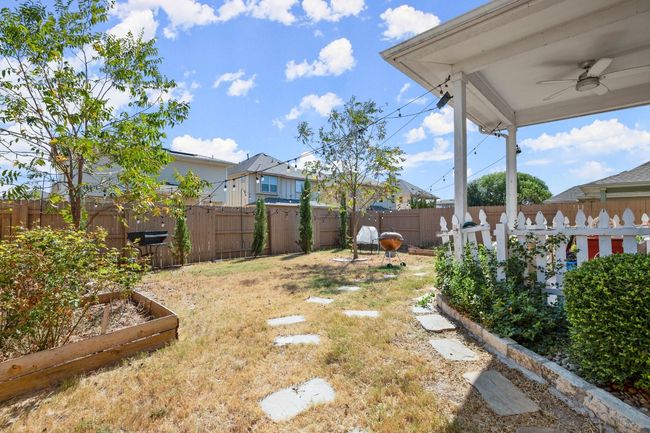 A covered patio offers the perfect spot for outdoor dining or relaxing in the shade. | Image 20