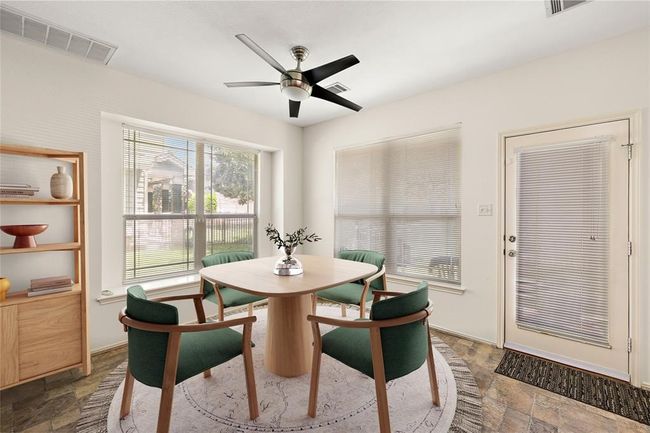 Enjoy meals in this cozy dining nook, conveniently located next to the kitchen for added convenience. | Image 7