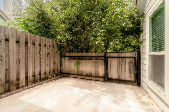 View of patio with fence | Image 24