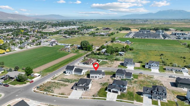 Aerial overview of property's location with a mountain backdrop | Image 36