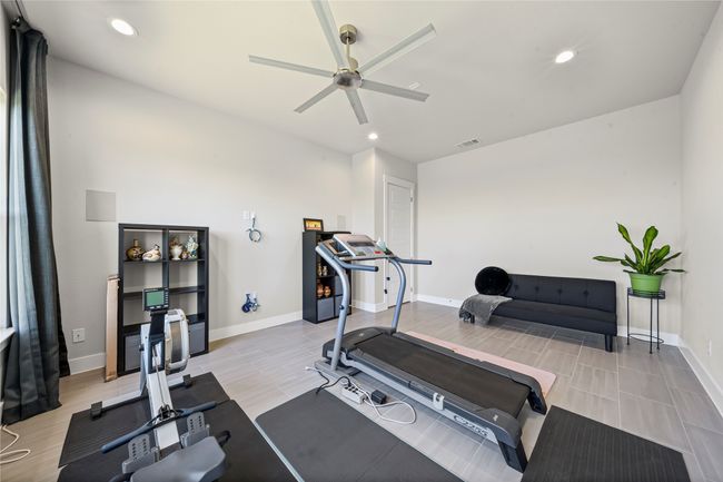 Exercise room with ceiling fan, recessed lighting, and wood tiled floors | Image 19