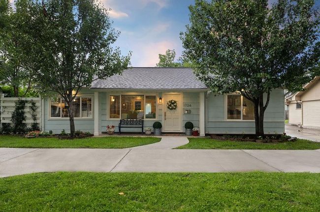 A convenient circle driveway (very rare for Oak Forest) provides ample guest parking, while the long private driveway and 2-car garage provide privacy and protection for your cars. | Image 26