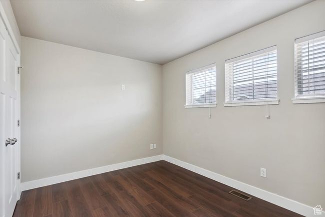 Spare room with baseboards and dark wood finished floors | Image 24