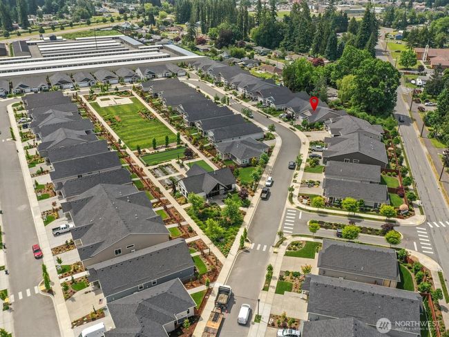 Brickyard Park is a vibrant community. With an acre sized park in the middle of the loop, there are activities for everyone! Outside you'll find a pickleball court, bocce ball court, horseshoes, and space for setting up cornhole boards. | Image 23