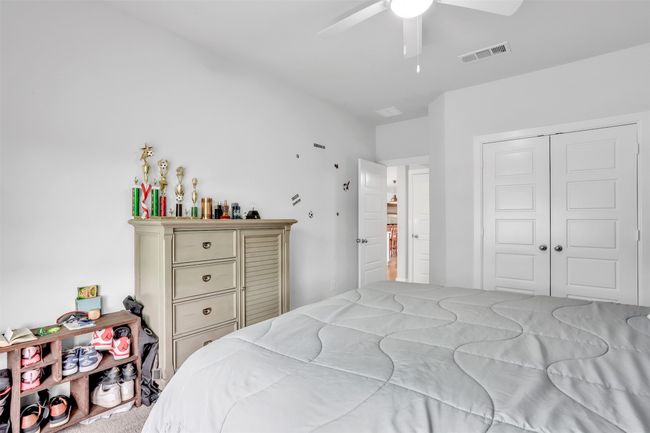 Bedroom with ceiling fan and a closet | Image 22