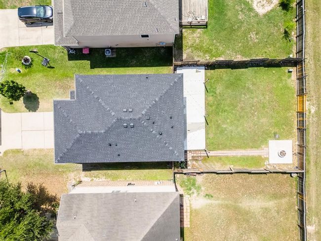 Beautiful square backyard offers a balanced layout, perfect for outdoor activities, gardening, or relaxing. | Image 32