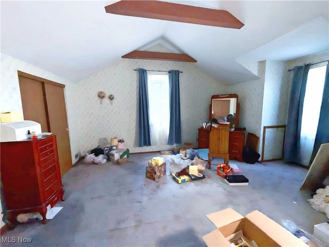 Bonus room featuring lofted ceiling, carpet flooring, and wallpapered walls | Image 24