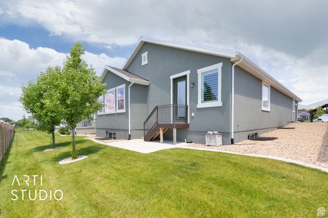 Rear view of house featuring a patio and stucco siding | Image 37