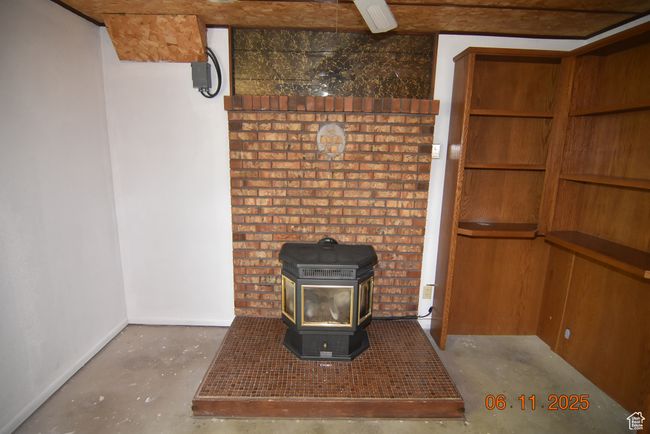 Downstairs family room area with gas stove | Image 46