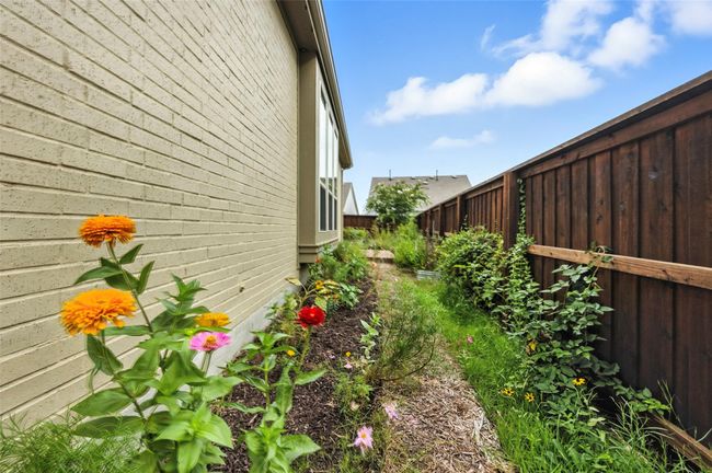 View of side of property featuring a fenced backyard | Image 33
