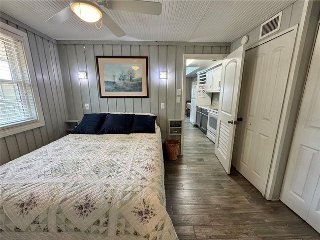Primary bedroom off the kitchen. Built in closet and has a full primary bathroom with laundry closet | Image 14
