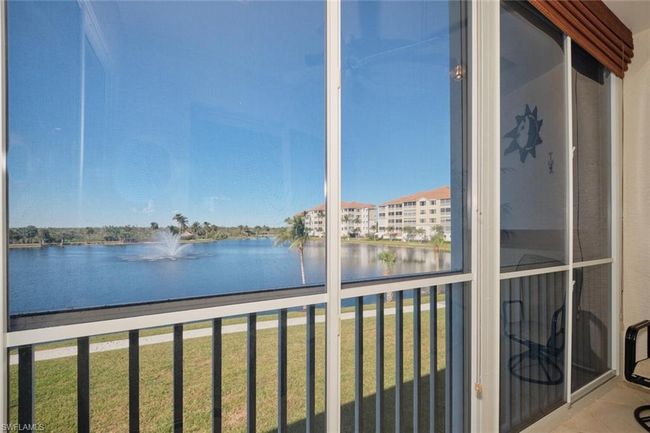 Unfurnished sunroom with a water view | Image 9