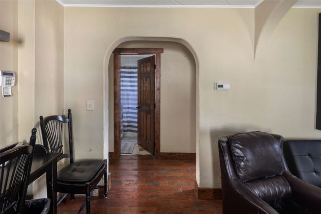 Living area featuring arched walkways, ornamental molding, and hardwood / wood-style flooring | Image 16