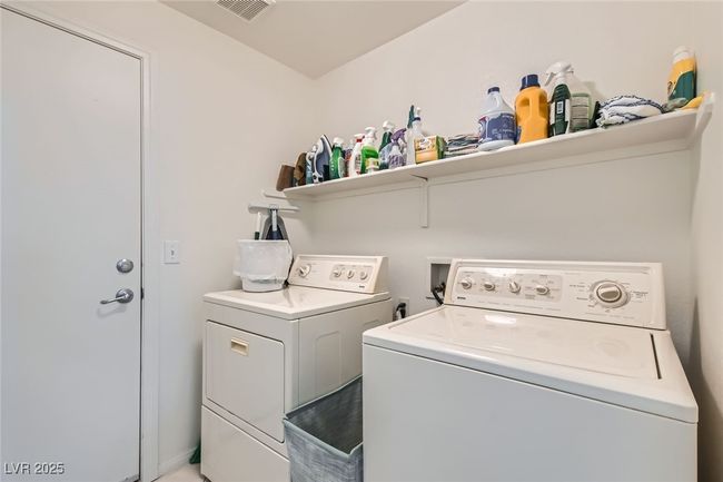 Laundry room with washing machine and clothes dryer | Image 37