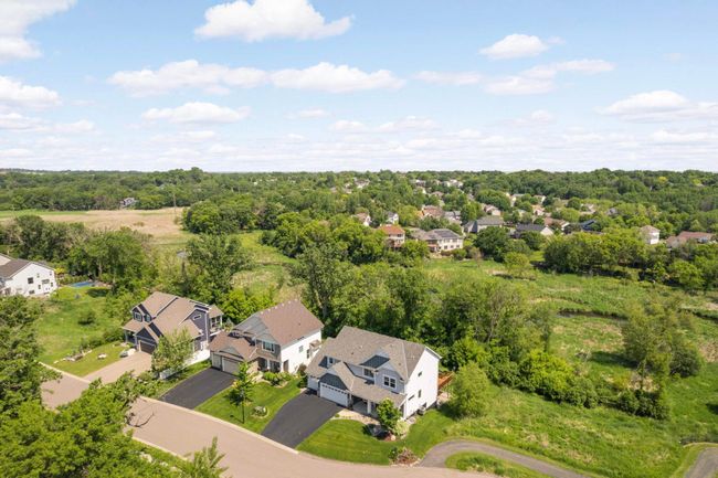 Aerial view shows the Credit River and wetlands behind the home. | Image 4