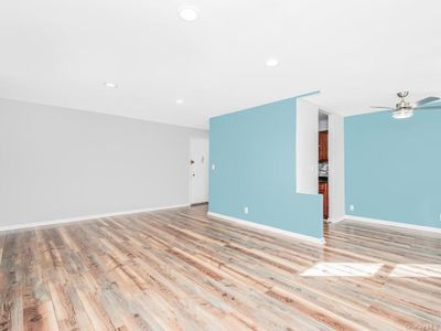 Unfurnished room featuring light hardwood / wood-style floors and ceiling fan | Image 3