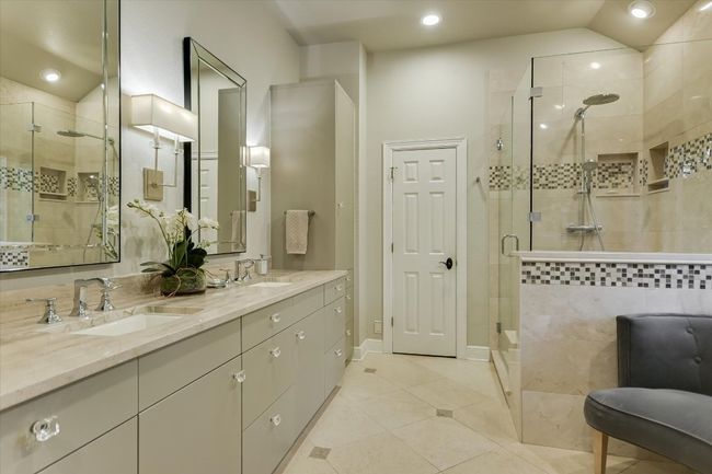 Primary bath with a shower stall, a sink, double vanity, recessed lighting, and tile patterned floors | Image 12